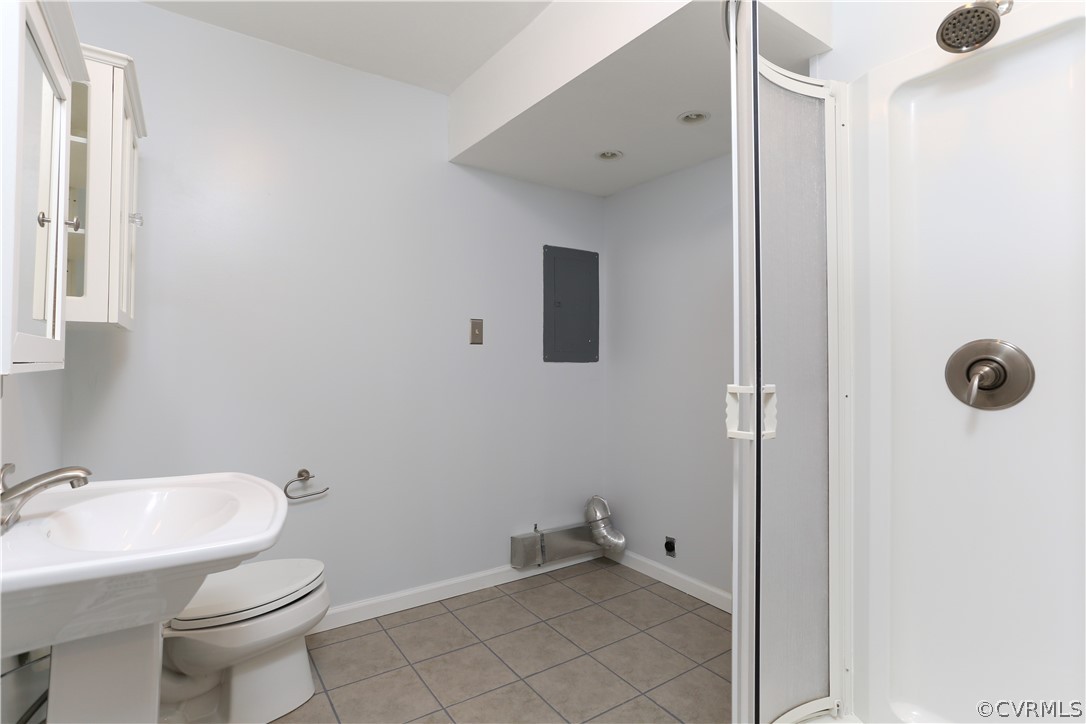14104 South Hackberry Road Chester, VA 23836 - Photo 24 of 27 a bathroom with a sink toilet and shower