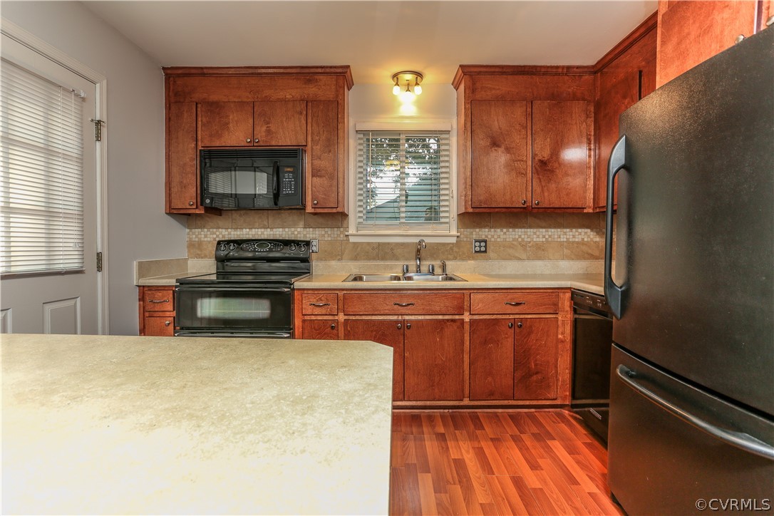 14104 South Hackberry Road Chester, VA 23836 - Photo 27 of 27 a kitchen with stainless steel appliances a stove sink and a refrigerator