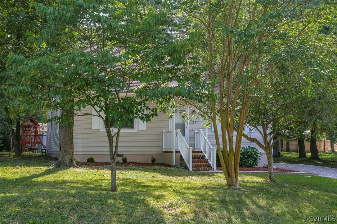 14104 South Hackberry Road Chester, VA 23836 - Photo 3 of 27 a view of a backyard with a tree