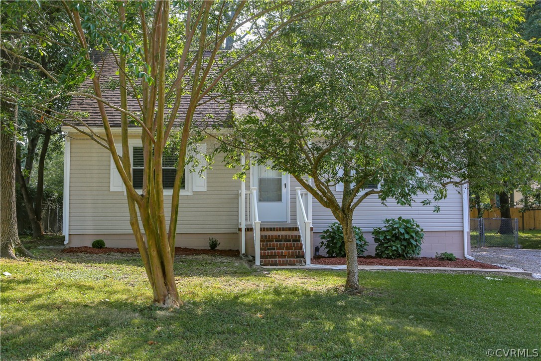 14104 South Hackberry Road Chester, VA 23836 - Photo 4 of 27 a large tree in front of a house with a tree