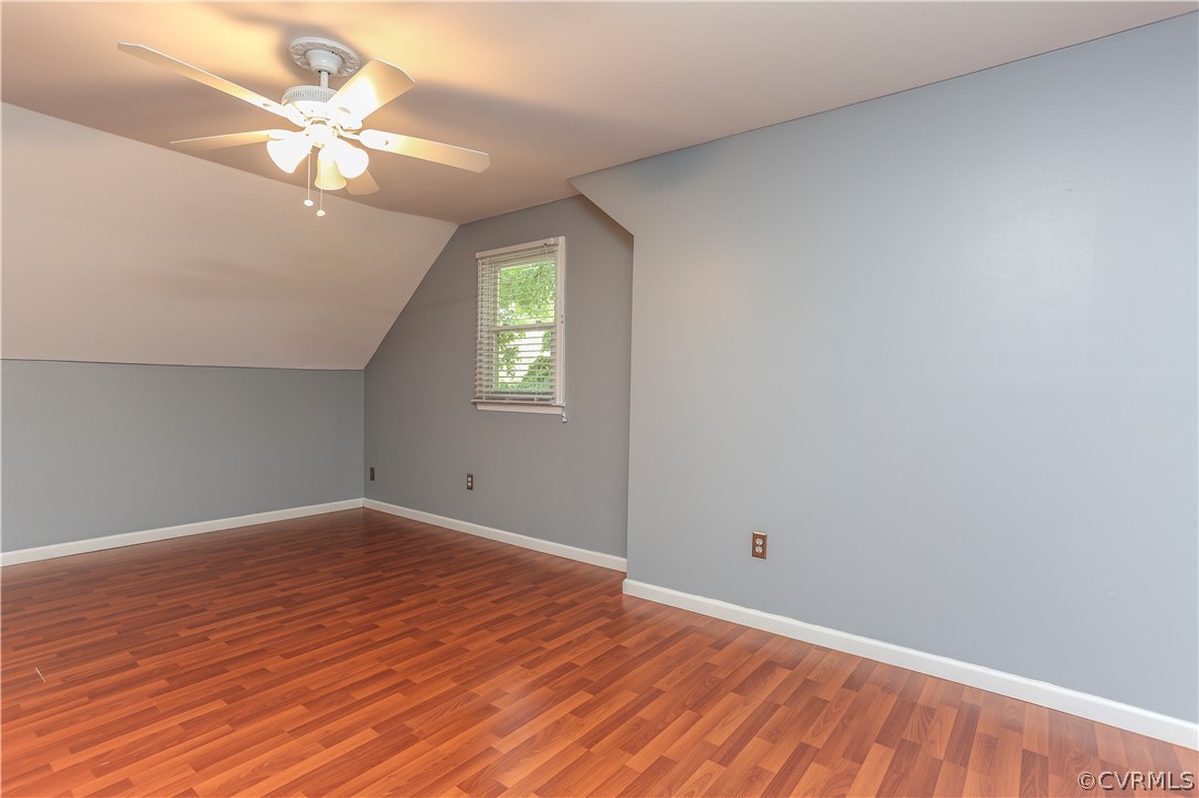 14104 South Hackberry Road Chester, VA 23836 - Photo 7 of 27 wooden floor in an empty room with a window