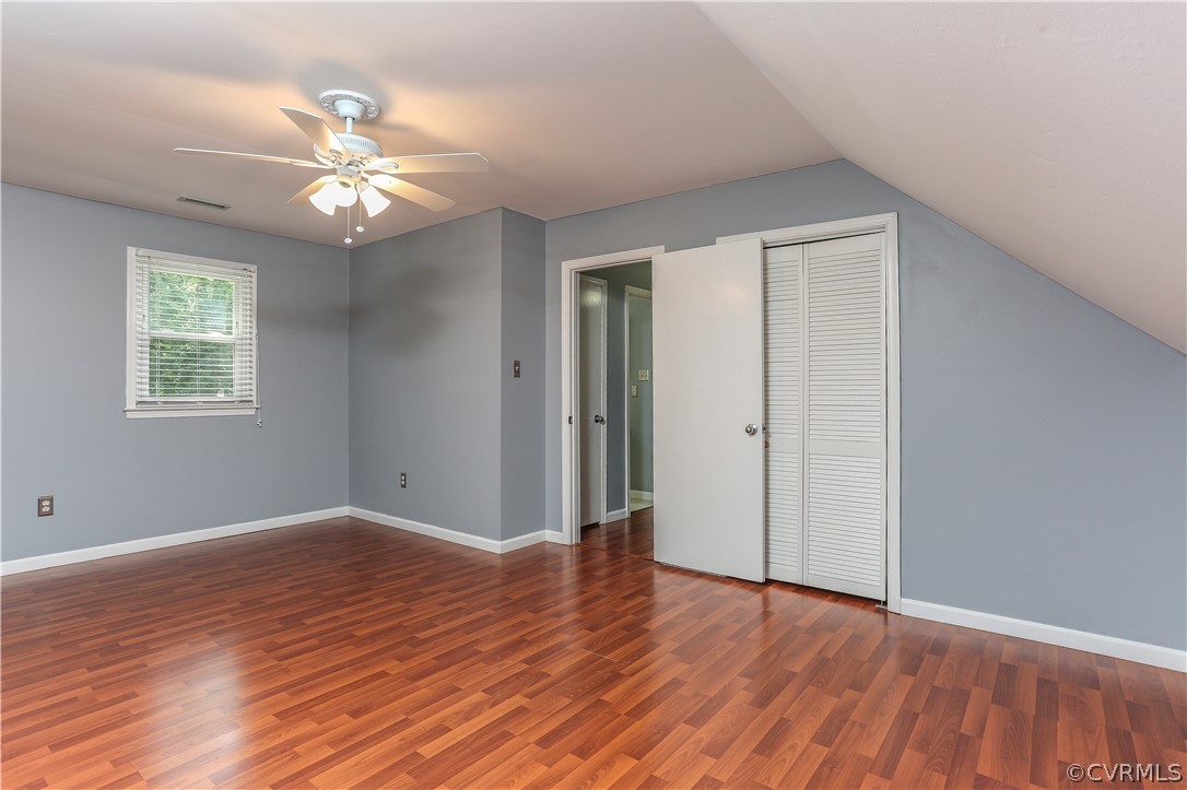 14104 South Hackberry Road Chester, VA 23836 - Photo 9 of 27 a view of an empty room with wooden floor