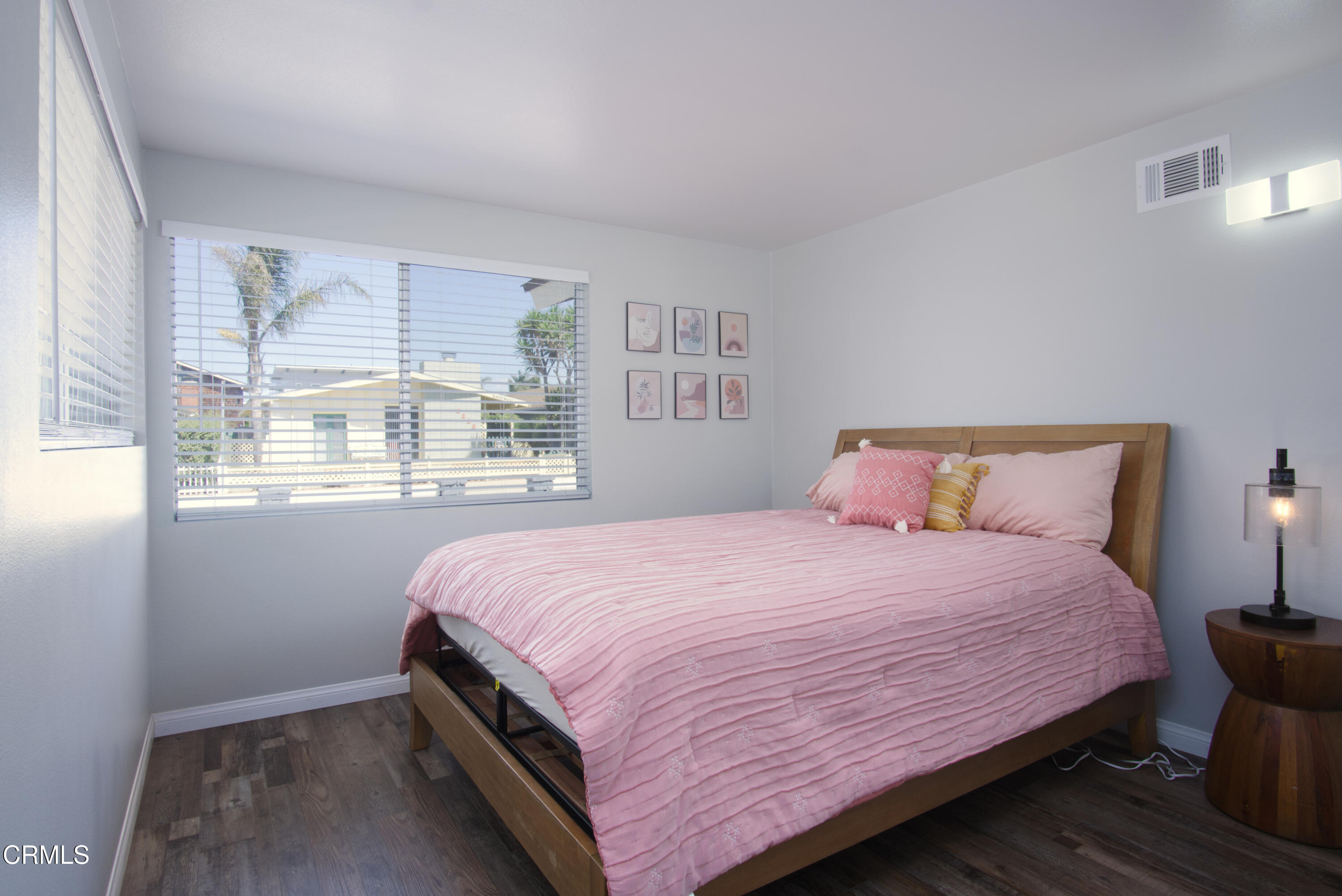 5230 Beachcomber Street Oxnard, CA 93035 - Photo 4 of 13 a bedroom with a bed and window