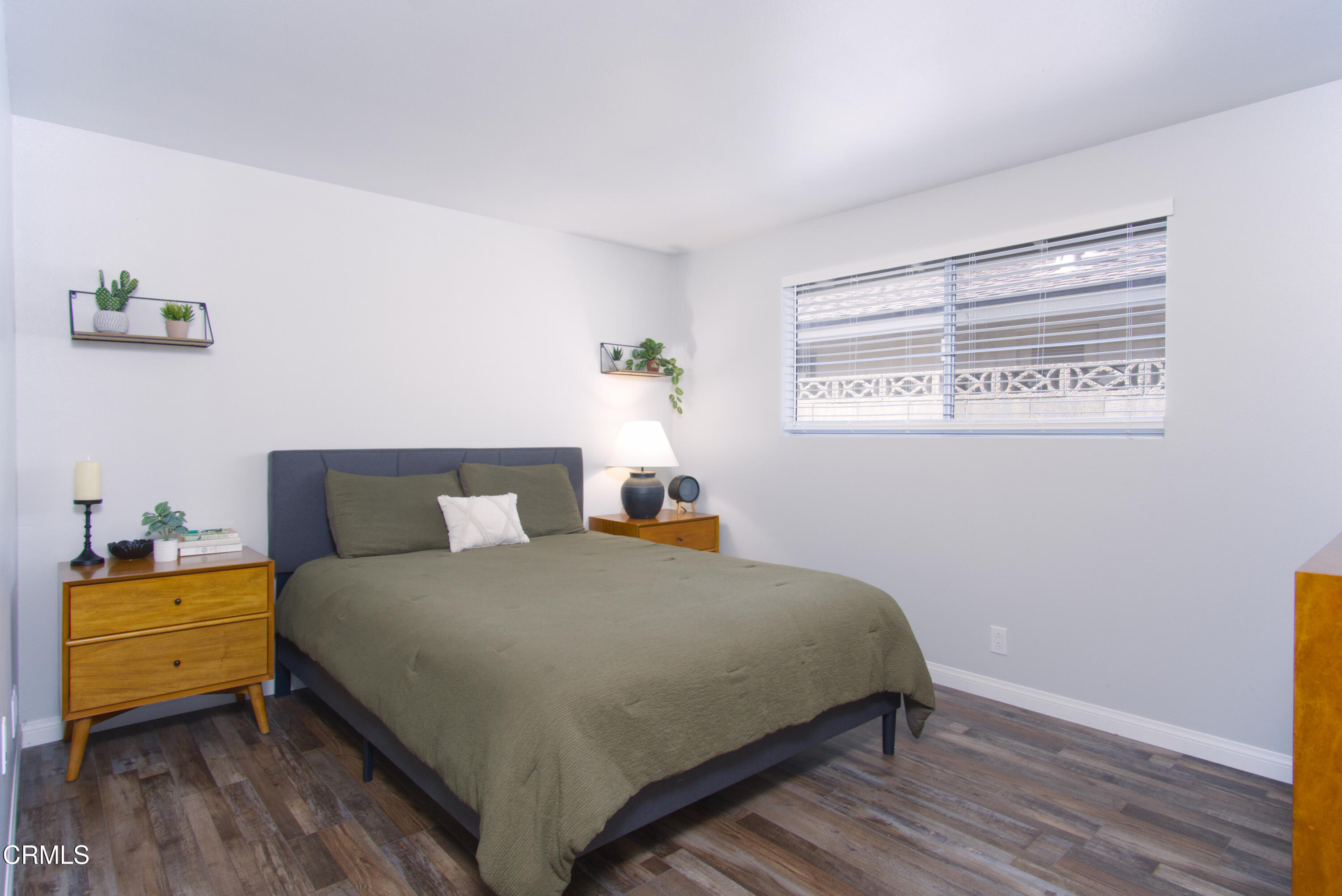 5230 Beachcomber Street Oxnard, CA 93035 - Photo 5 of 13 a bedroom with a bed and a window
