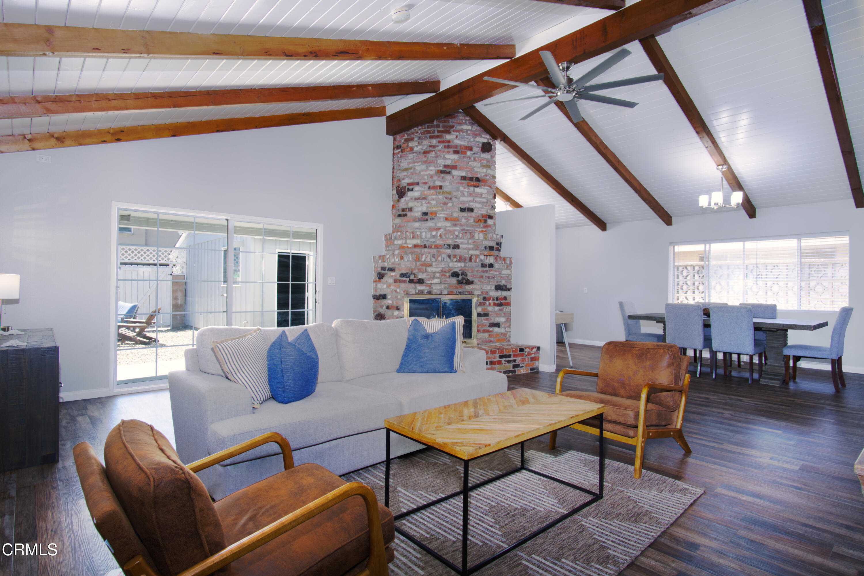 5230 Beachcomber Street Oxnard, CA 93035 - Photo 10 of 13 a living room with furniture a table and wooden floor