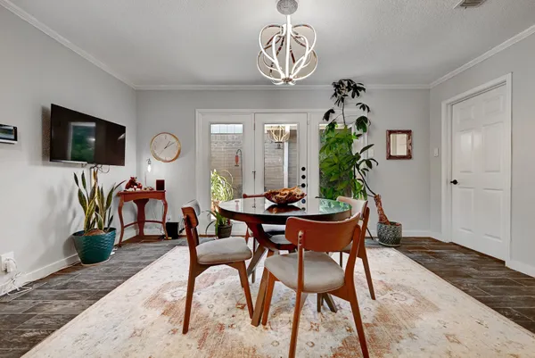 a view of a dining room with furniture and a window