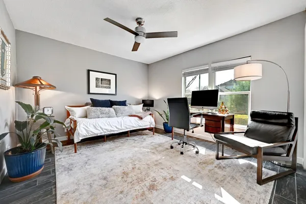 a bedroom with a workspace