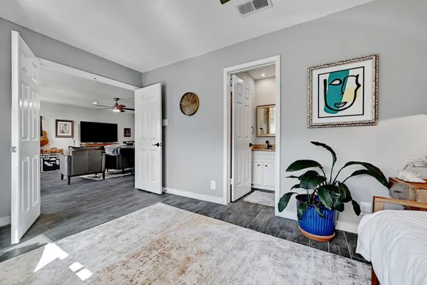 a view of a living room and bedroom