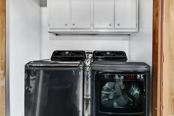 a close view of a stove top oven and cabinets