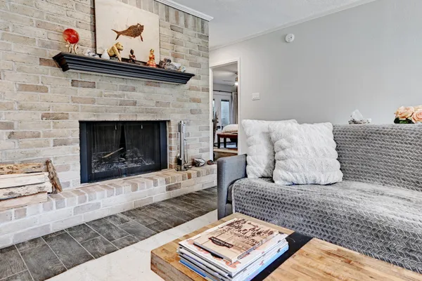a living room with furniture and a fireplace