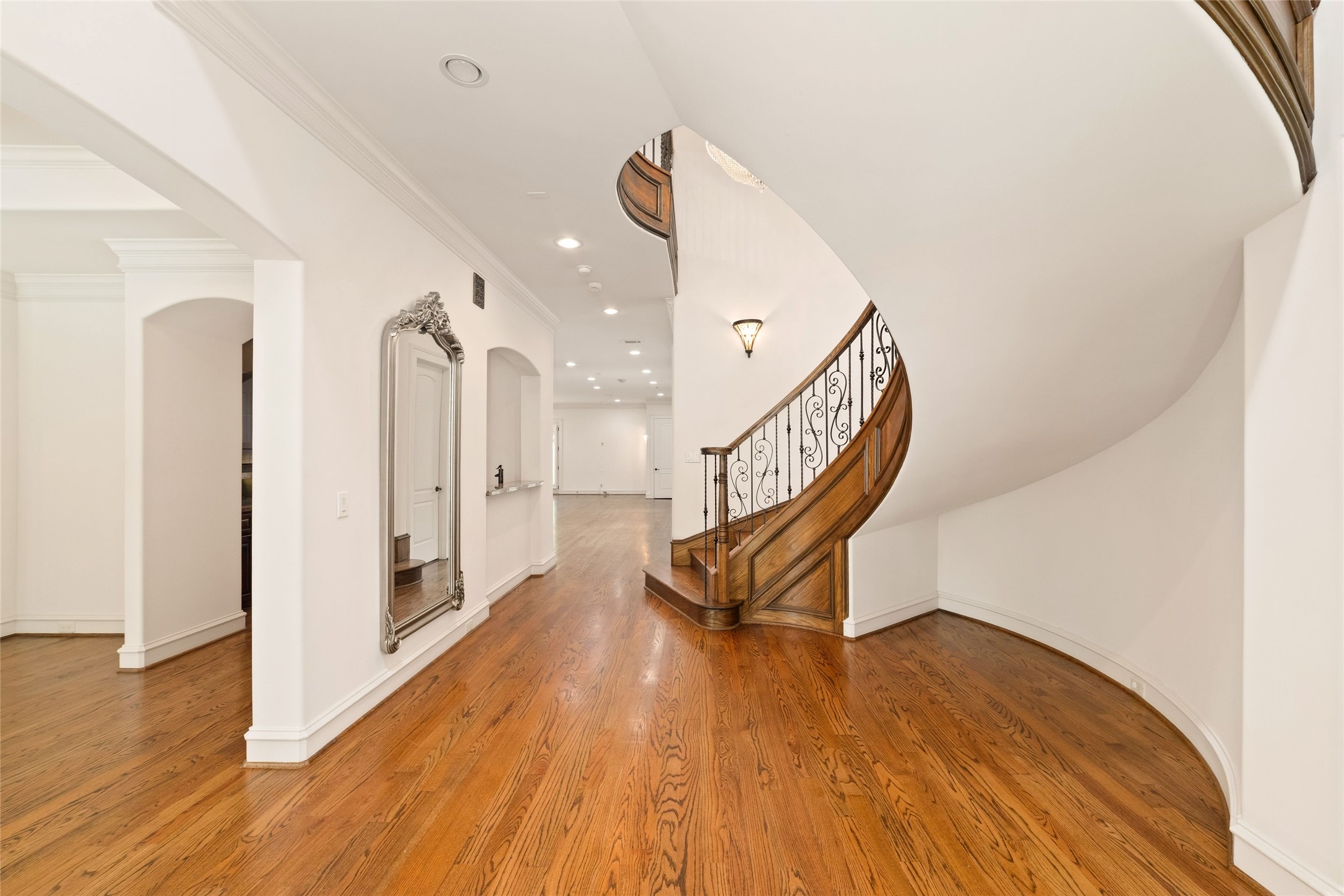 4102 Gramercy Street Houston, TX 77025 - Photo 5 of 35 a view of a hallway with wooden floor and staircase