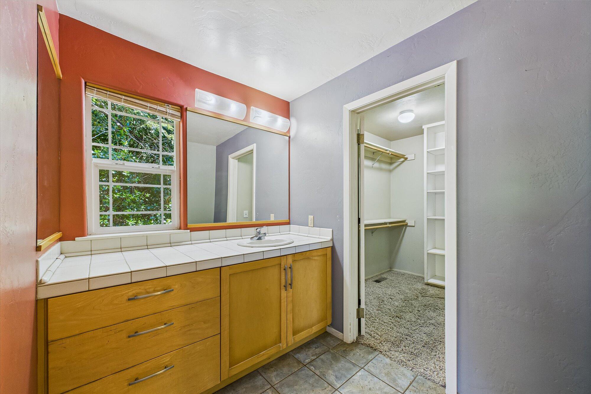 1945 Grange Road McKinleyville, CA 95519 - Photo 36 of 62 a bathroom with a sink and a mirror