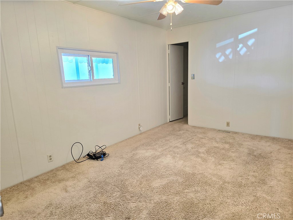 6271 East Sea Breeze Drive, Unit 36 Long Beach, CA 90803 - Photo 11 of 34 a view of a livingroom with a chandelier fan