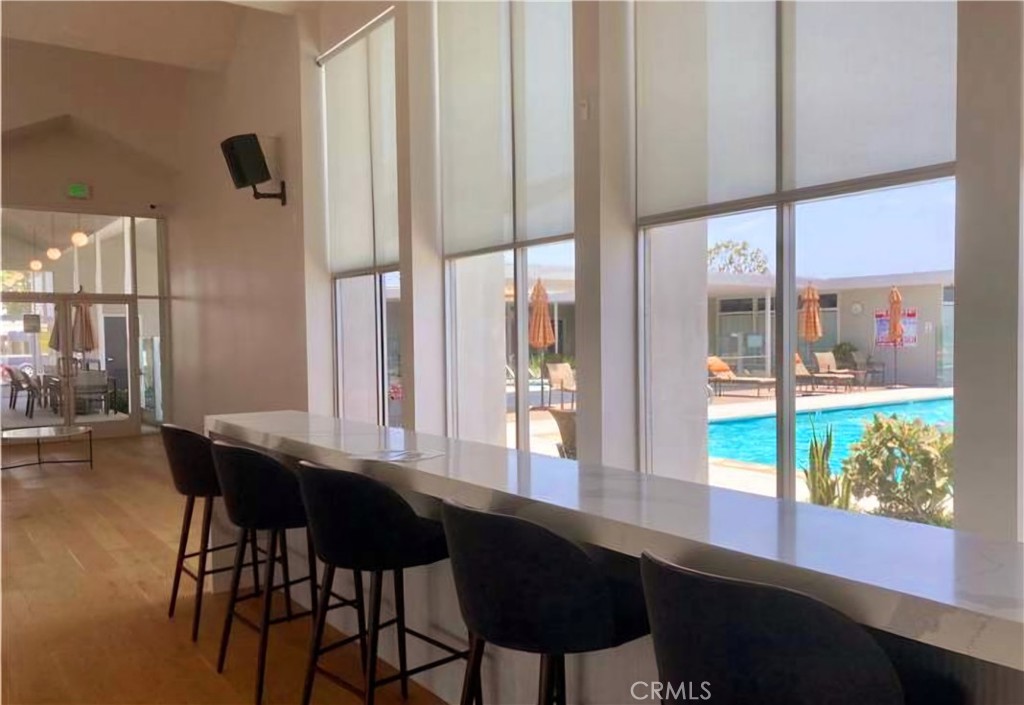 6271 East Sea Breeze Drive, Unit 36 Long Beach, CA 90803 - Photo 31 of 34 a view of a dining room with furniture window and wooden floor