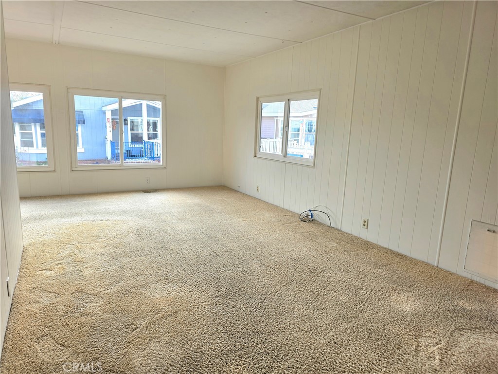 6271 East Sea Breeze Drive, Unit 36 Long Beach, CA 90803 - Photo 4 of 34 an empty room with windows