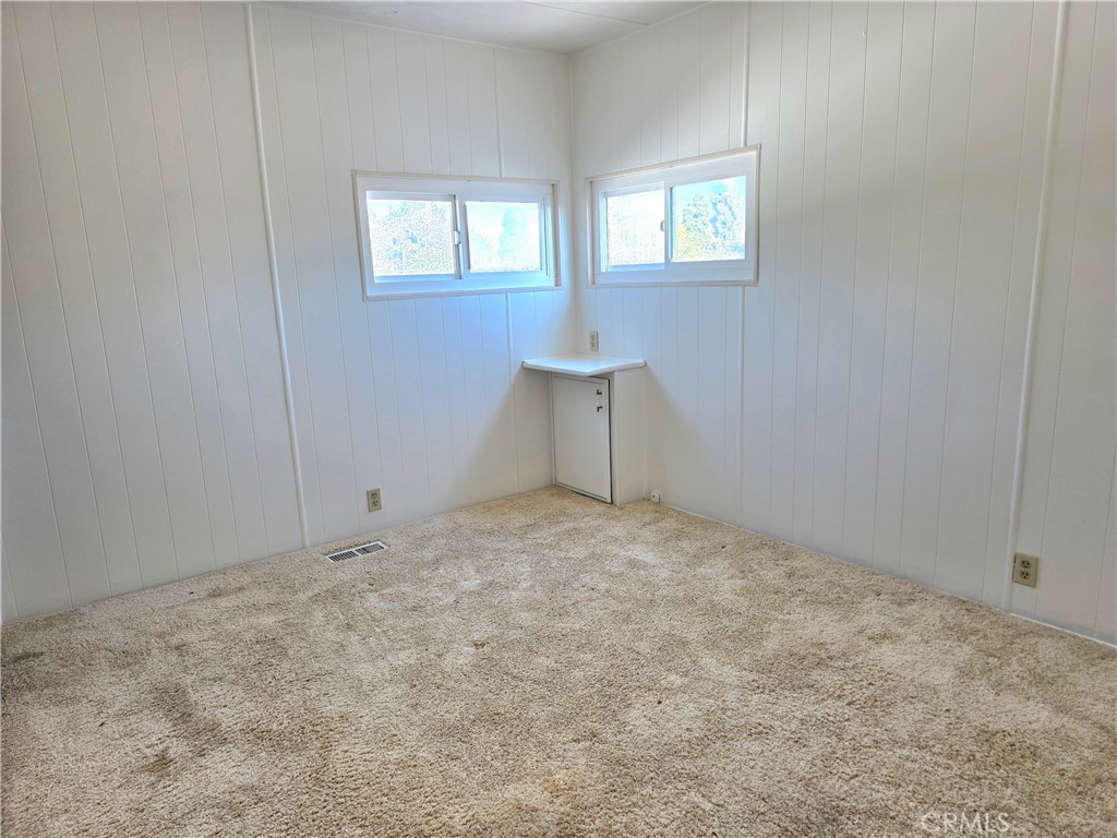 6271 East Sea Breeze Drive, Unit 36 Long Beach, CA 90803 - Photo 8 of 34 an empty room with windows