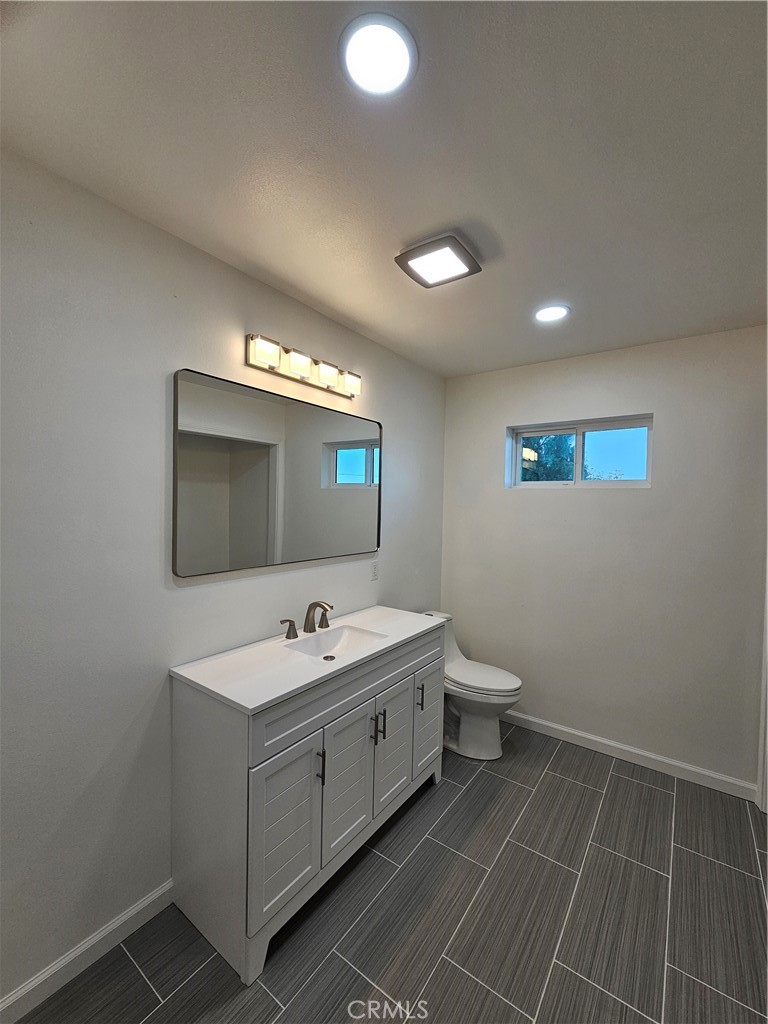2641 Valley View Avenue Norco, CA 92860 - Photo 14 of 24 a bathroom with a toilet sink and mirror