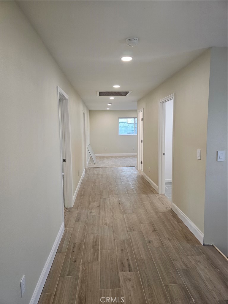 2641 Valley View Avenue Norco, CA 92860 - Photo 17 of 24 wooden floor in an empty room with a window
