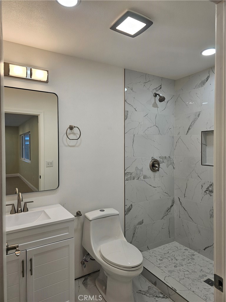 2641 Valley View Avenue Norco, CA 92860 - Photo 20 of 24 a bathroom with a sink a toilet and shower