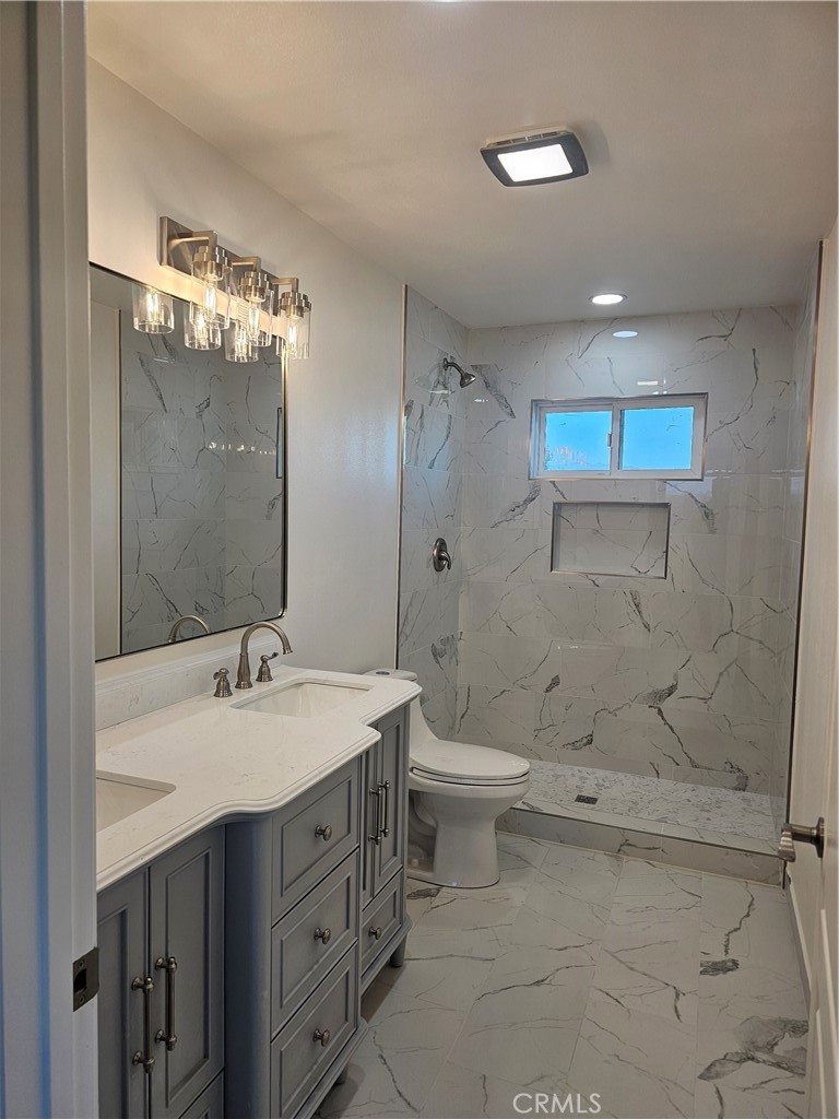 2641 Valley View Avenue Norco, CA 92860 - Photo 8 of 24 a bathroom with a sink a toilet and shower