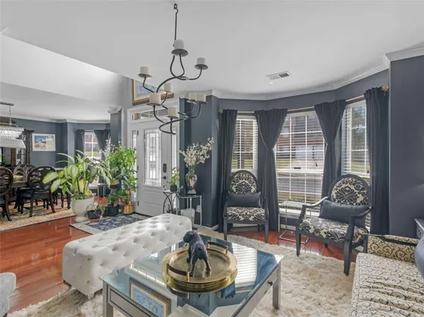 a kitchen with stainless steel appliances granite countertop a refrigerator a sink and a stove