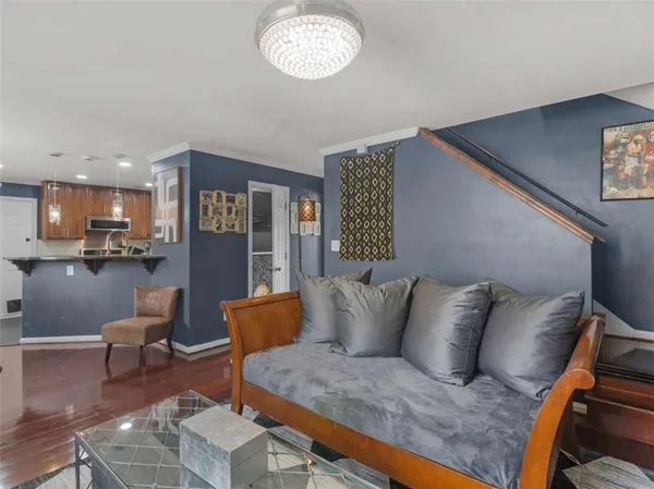 a bedroom with a bed and a television