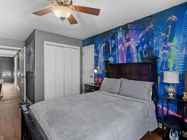 a bedroom with a workspace