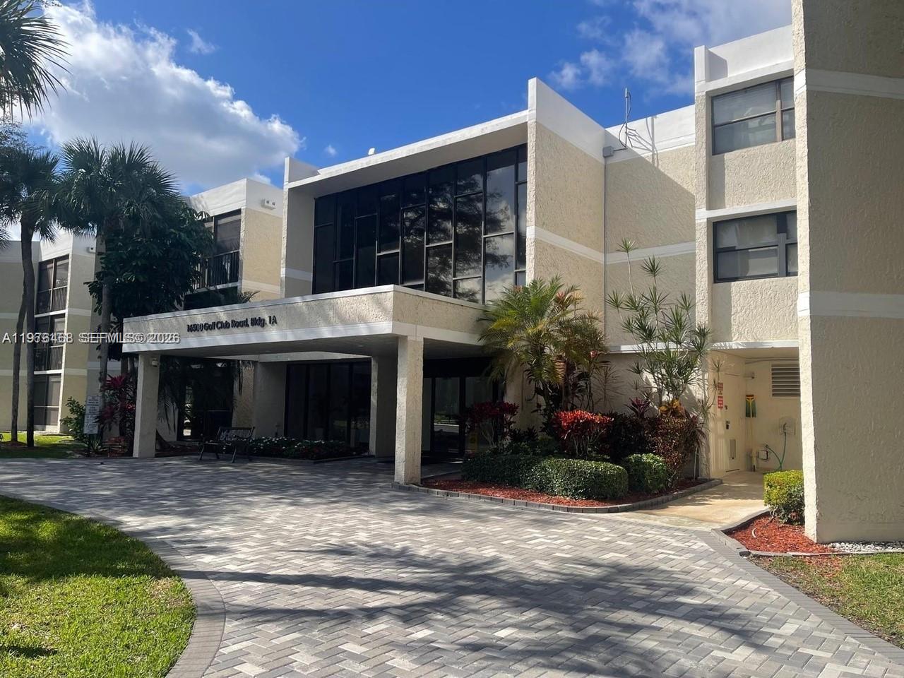 16500 Golf Club Road, Unit 205 Weston, FL 33326 - Photo 1 of 18 a view of a house with a yard