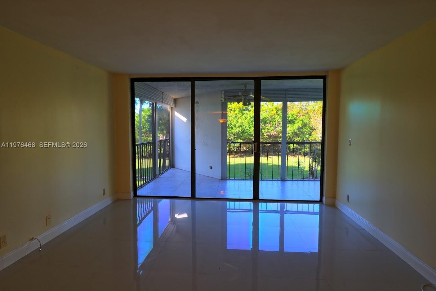 16500 Golf Club Road, Unit 205 Weston, FL 33326 - Photo 5 of 18 a view of empty room with floor to ceiling window