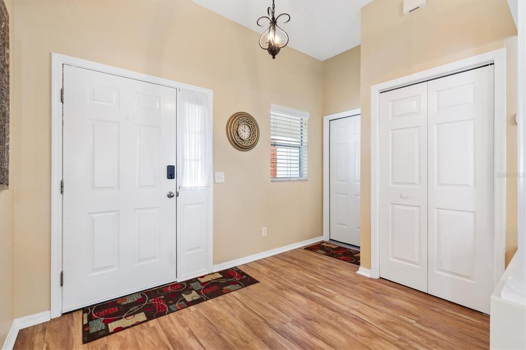 711 Agua Way Lady Lake, FL 32159 - Photo 2 of 16 a view of empty room with wooden floor