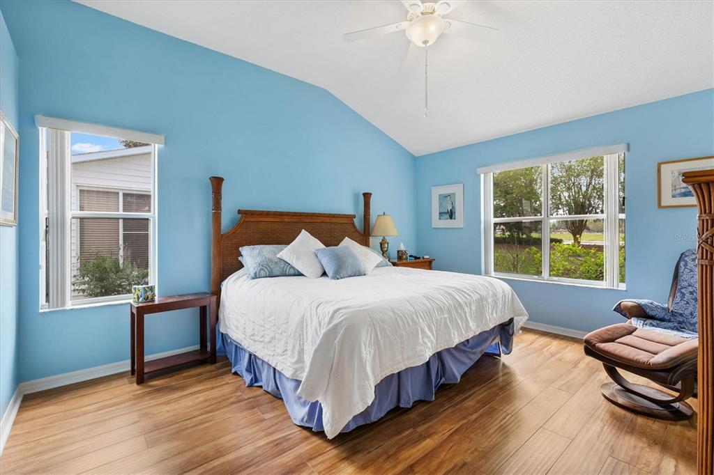 711 Agua Way Lady Lake, FL 32159 - Photo 8 of 16 a bedroom with a bed and a window
