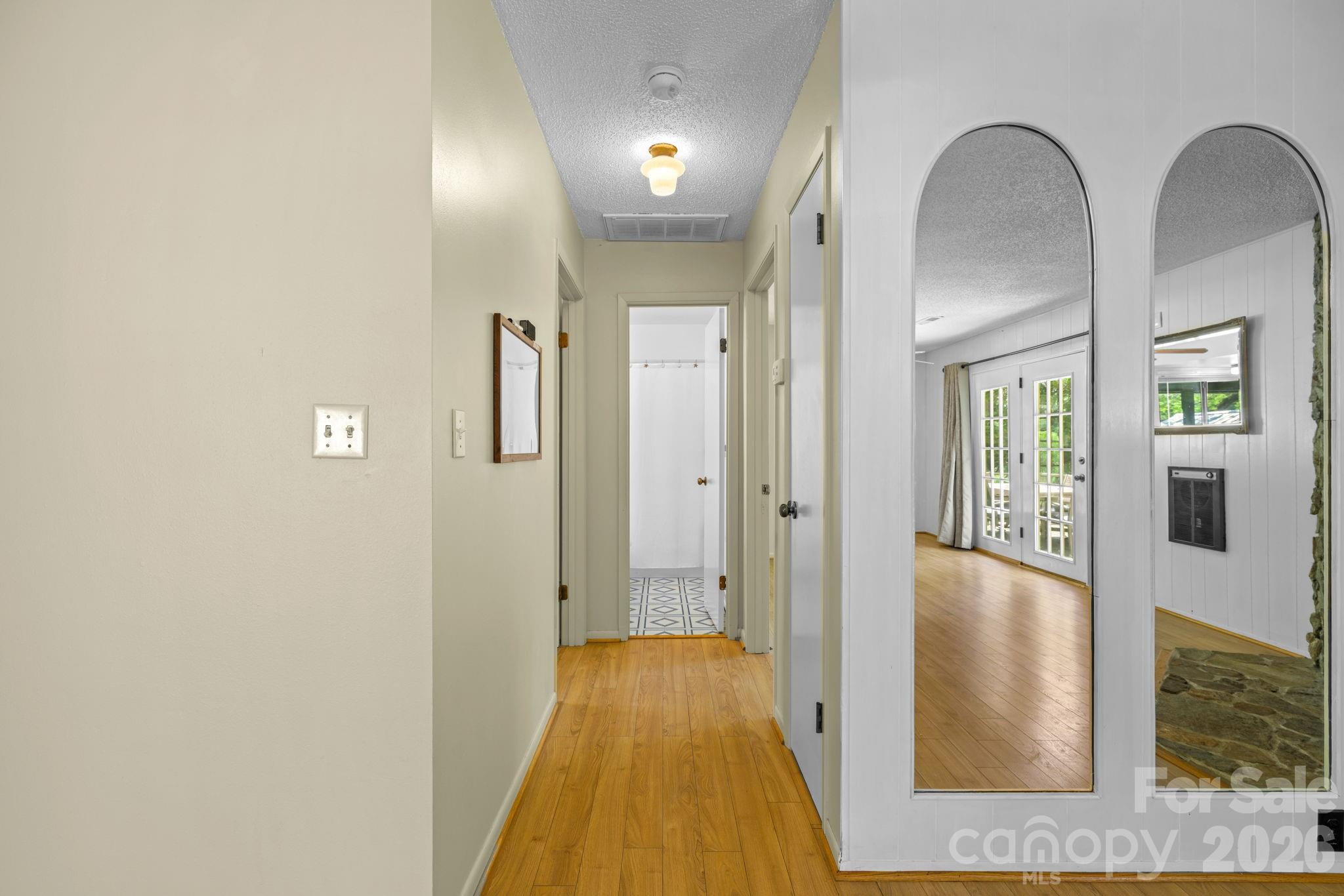 19 Quail Ridge Trail Franklin, NC 28734 - Photo 13 of 37 a view of a hallway view with wooden floor and staircase