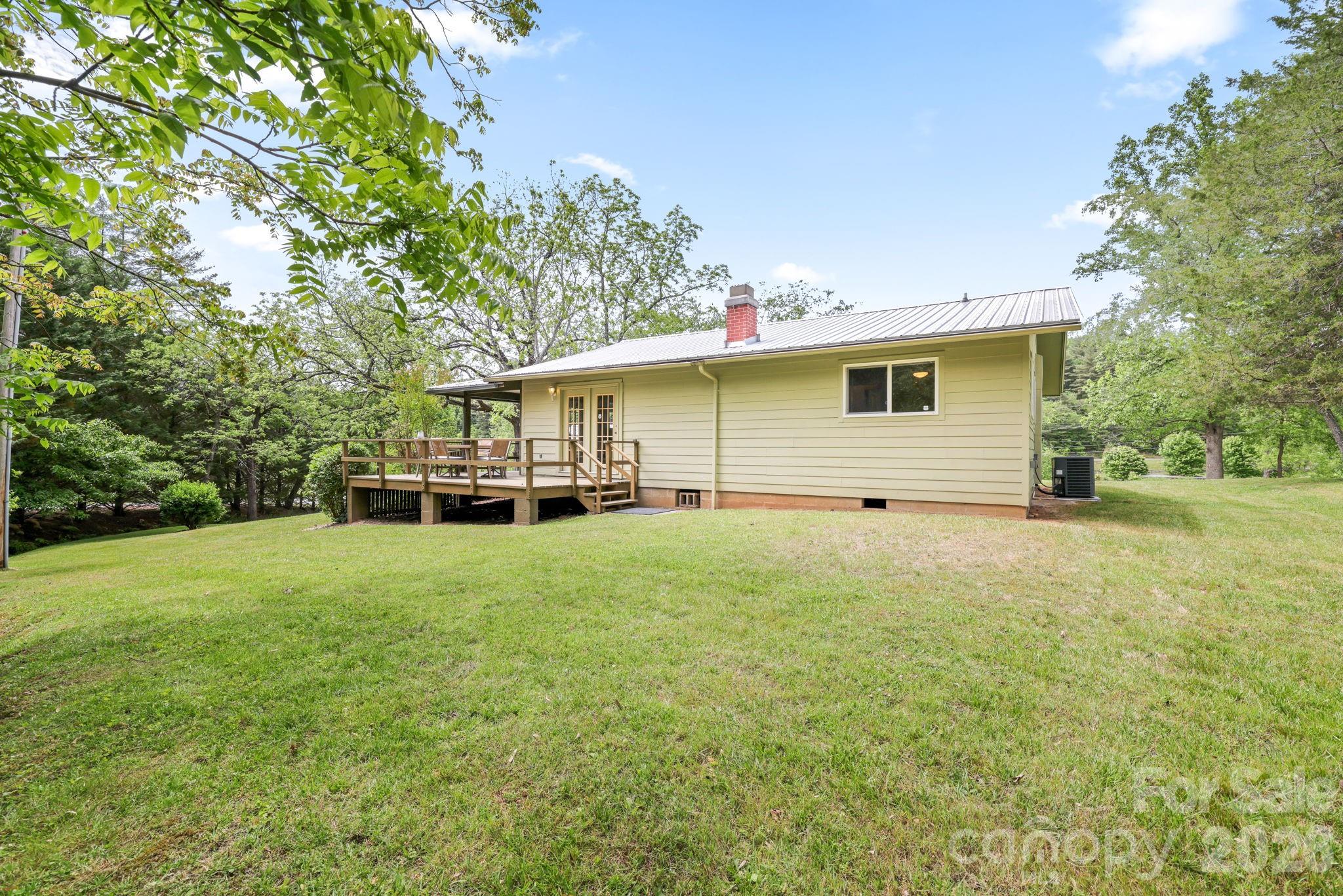 19 Quail Ridge Trail Franklin, NC 28734 - Photo 31 of 37 a house view with a backyard space