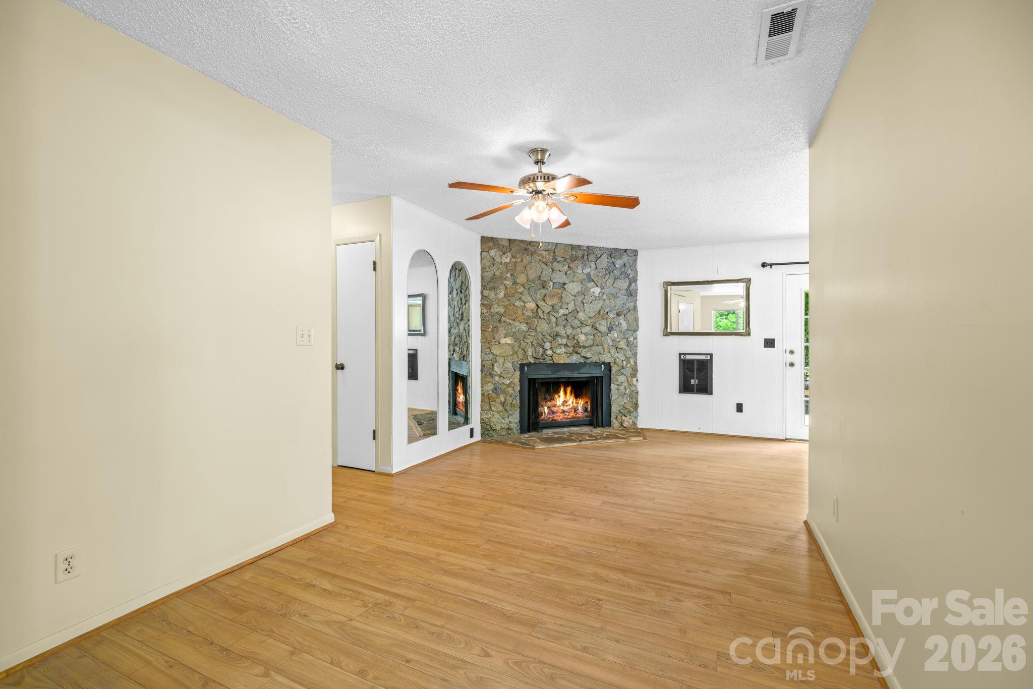 19 Quail Ridge Trail Franklin, NC 28734 - Photo 5 of 37 a view of an empty room with a fireplace