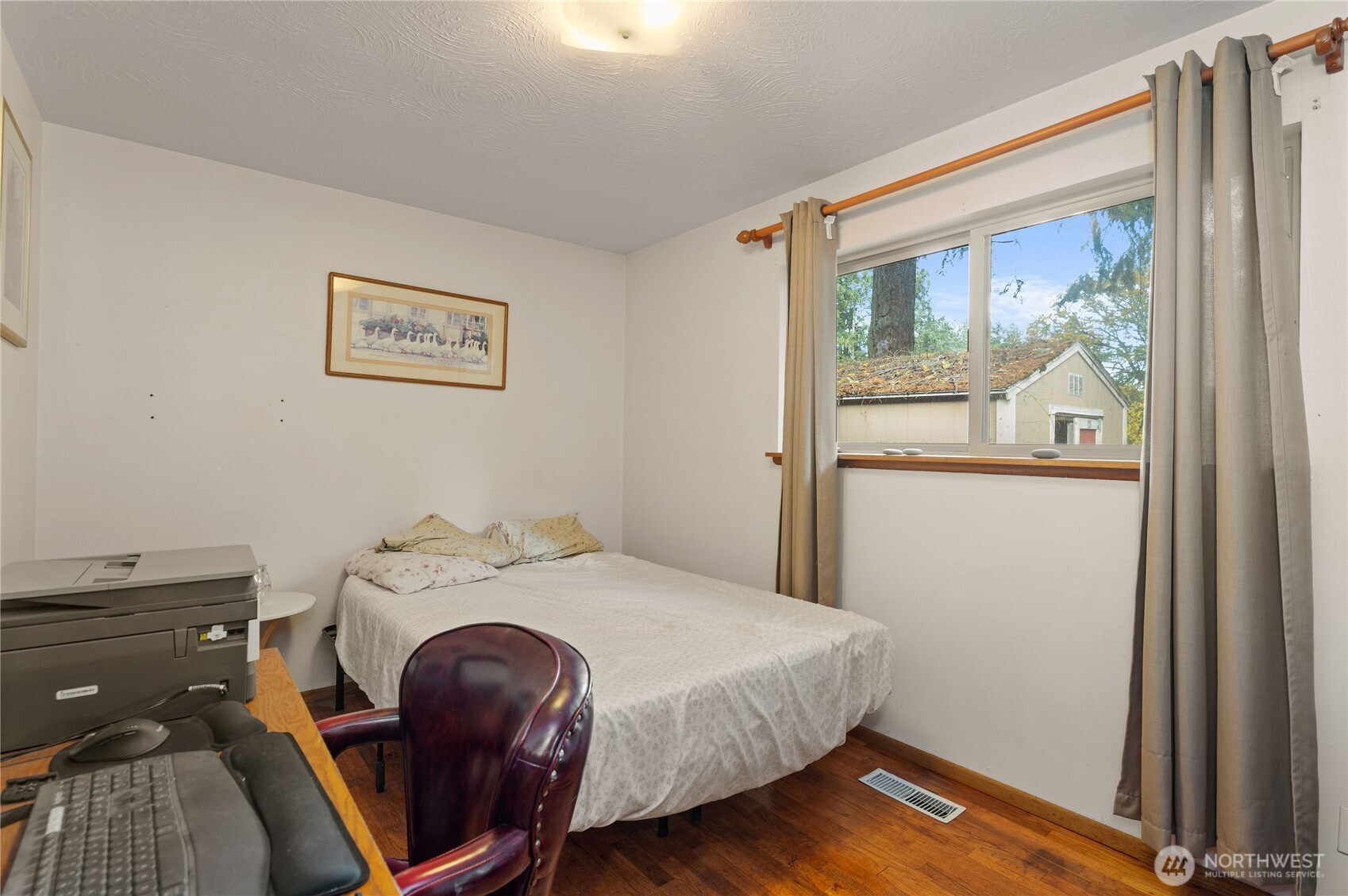 9101 112th Street Southwest Lakewood, WA 98498 - Photo 17 of 24 a bedroom with a bed and a window