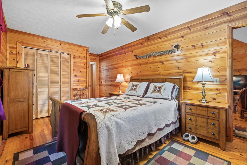 1503 Millenium Drive Young Harris, GA 30582 - Photo 15 of 55 a bedroom with a bed and wooden floor