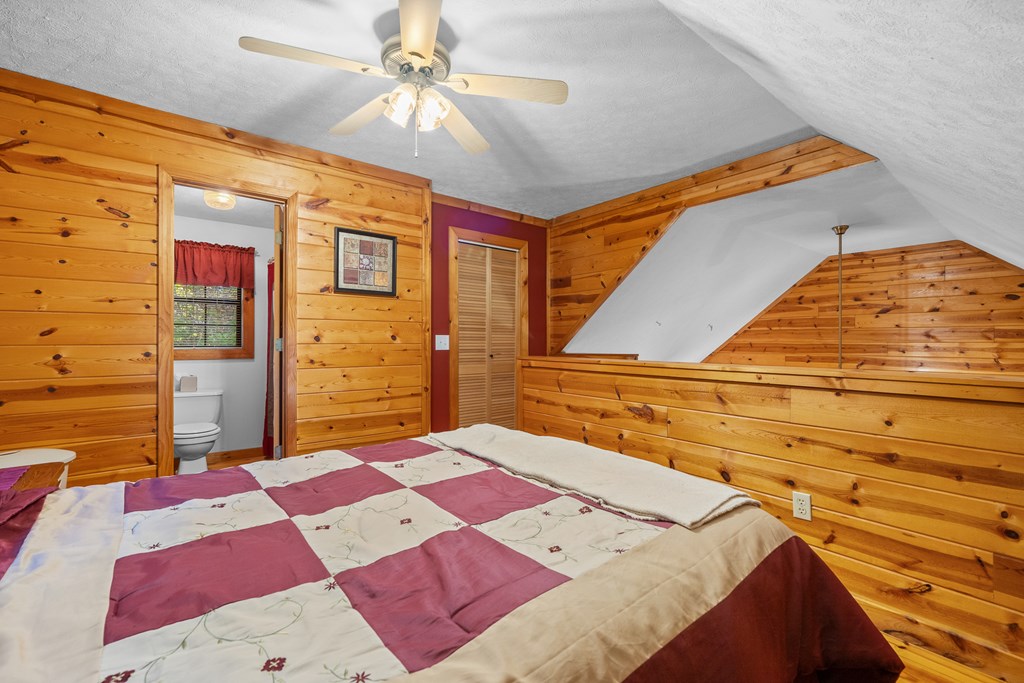 1503 Millenium Drive Young Harris, GA 30582 - Photo 20 of 55 a bed sitting in a bedroom next to a window