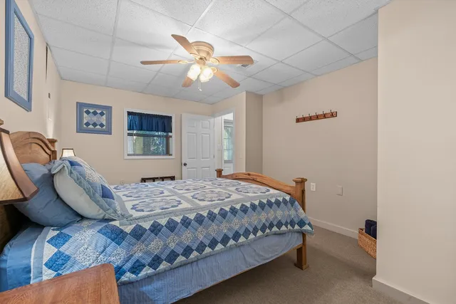 a room with a walk in shower closet and a window