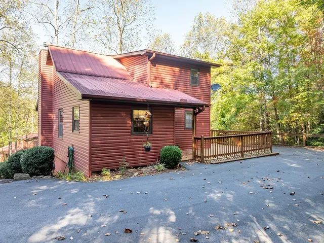 a view of backyard with a deck