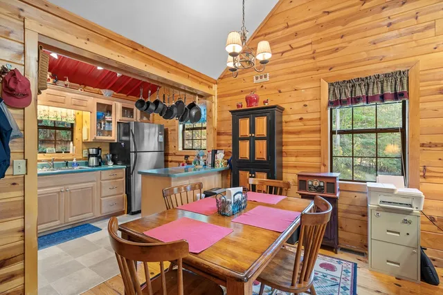 a dining room with furniture and window