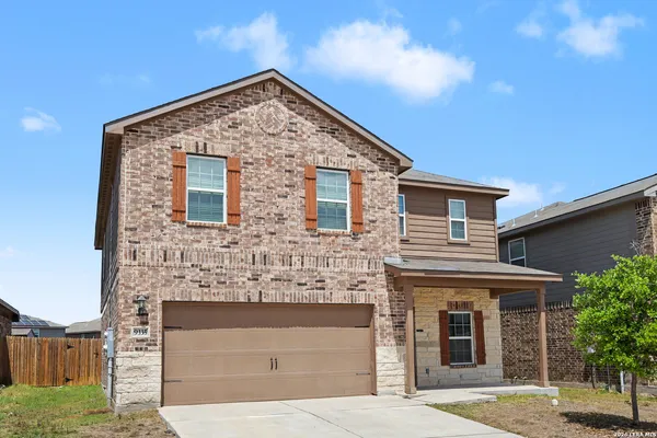 a front view of a house with garage