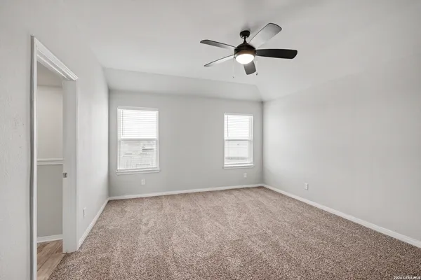 a view of room with window and ceiling fan