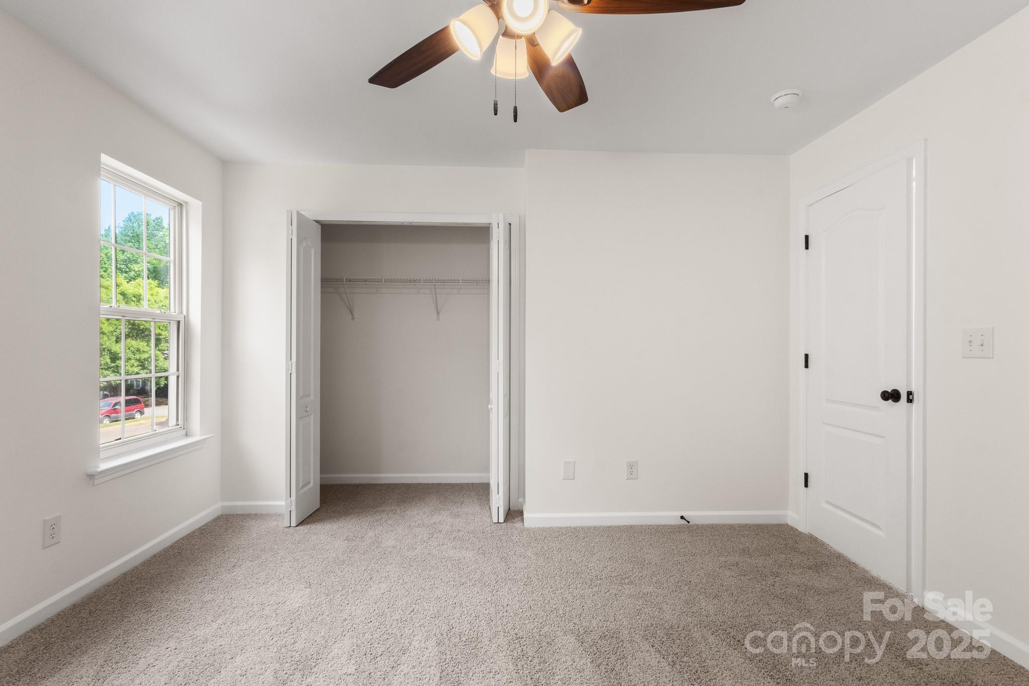 5529 Seths Drive Charlotte, NC 28269 - Photo 21 of 32 a view of an empty room with a window
