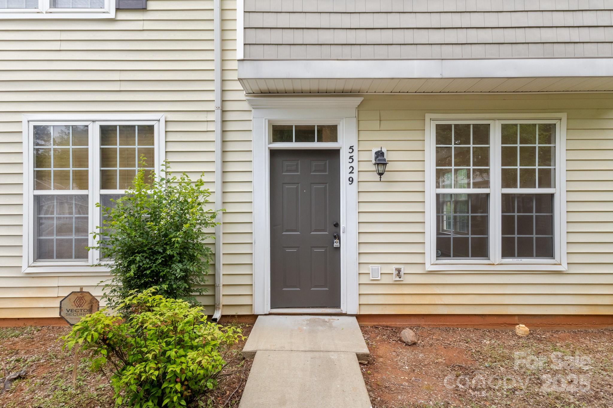 5529 Seths Drive Charlotte, NC 28269 - Photo 32 of 32 a front view of a house with a garage