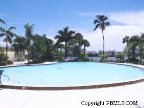 44 Cocoanut Row, Unit 604B Palm Beach, FL 33480 - Photo 2 of 2 a view of swimming pool with a yard and palm trees