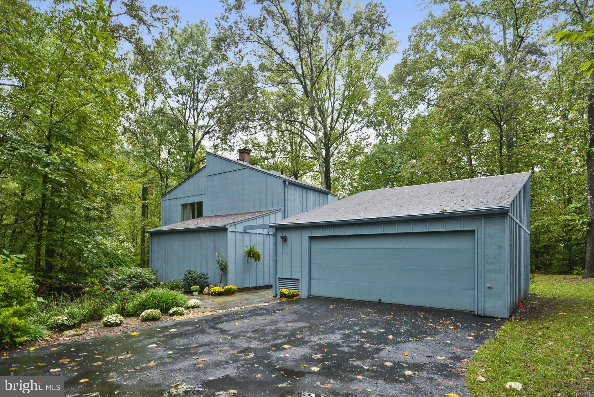 2600 Tack Lane Reston, VA 20191 - Photo 1 of 30 a view of a house with a large tree and a yard