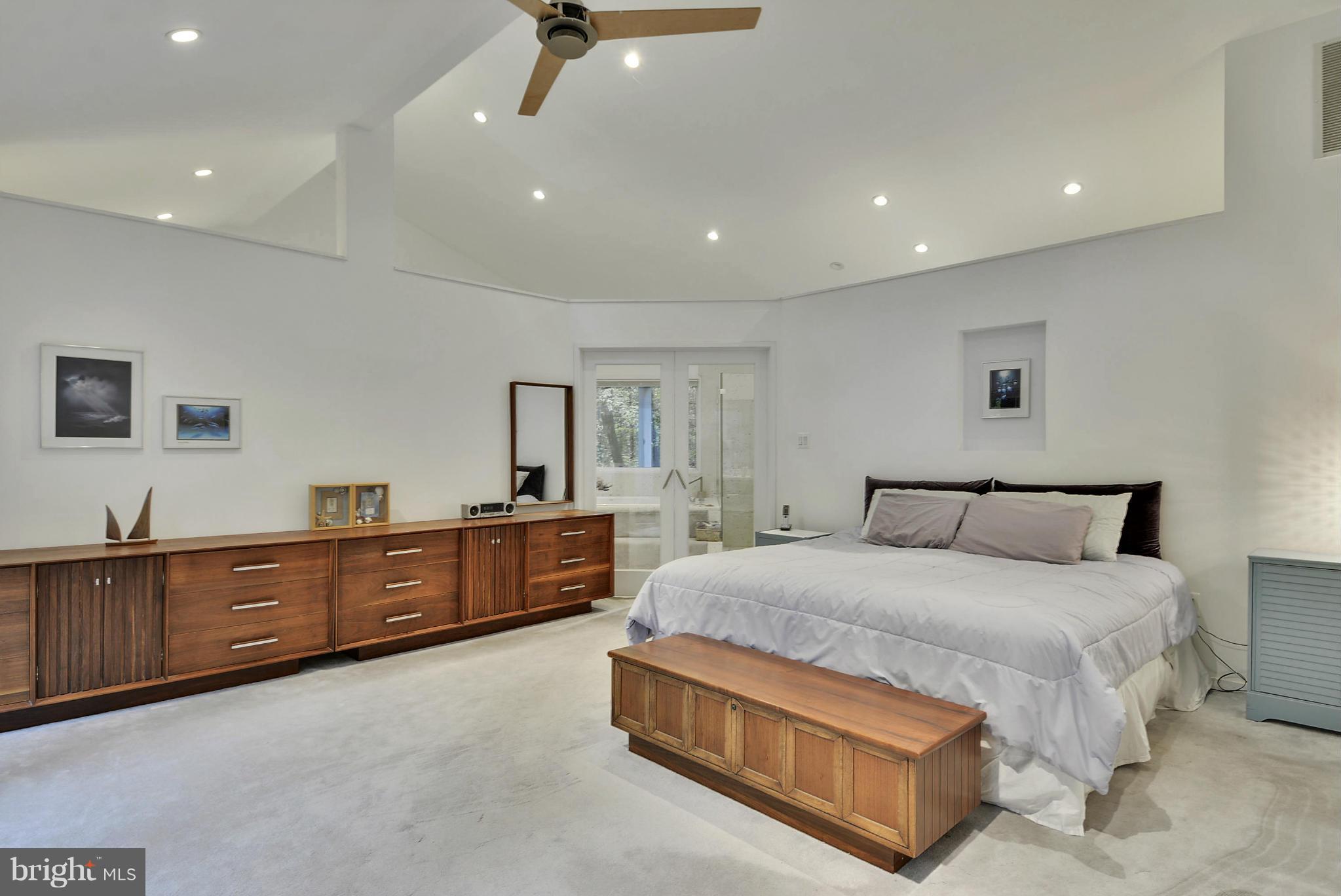 2600 Tack Lane Reston, VA 20191 - Photo 11 of 30 a spacious bedroom with a large bed and a dresser