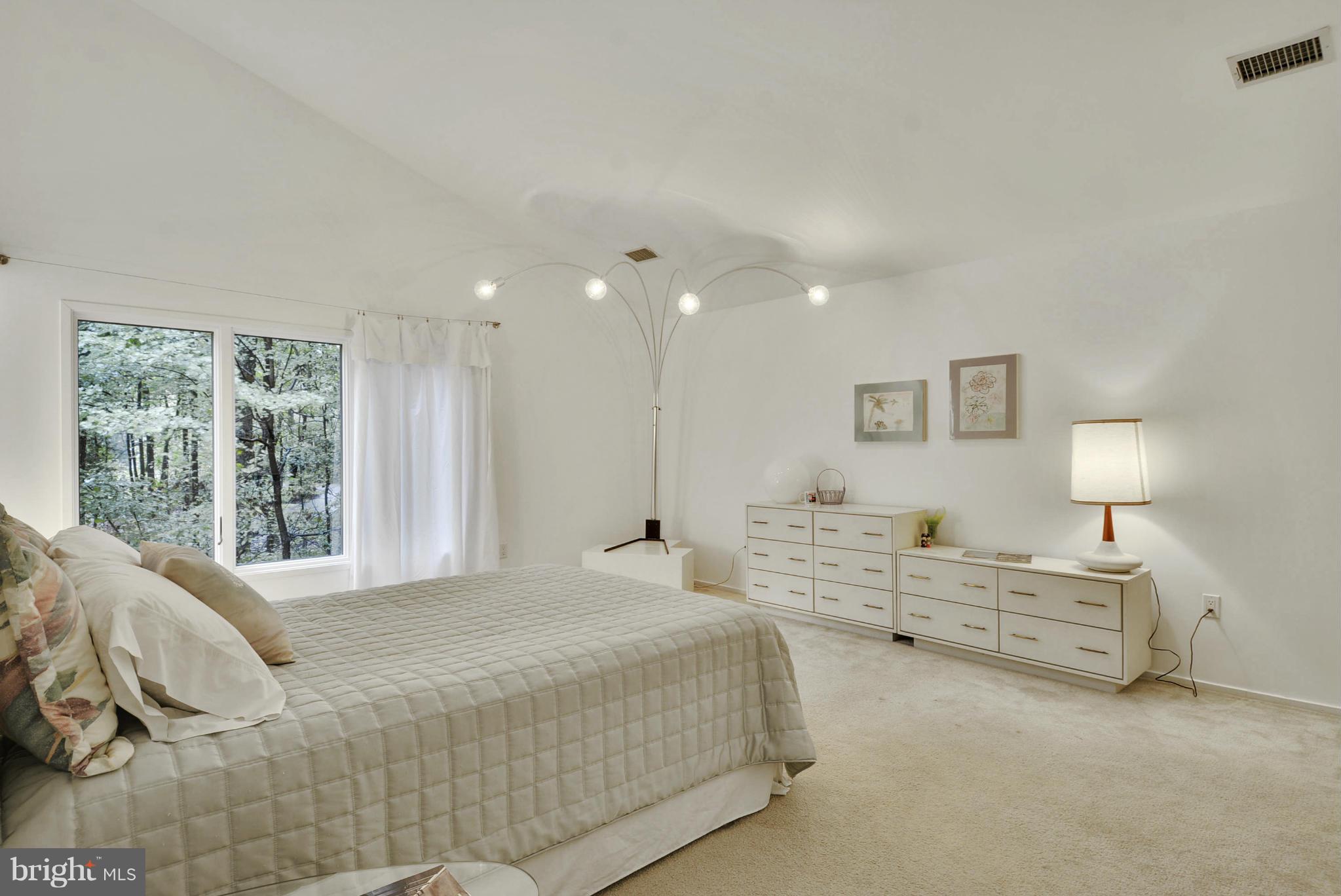 2600 Tack Lane Reston, VA 20191 - Photo 17 of 30 a spacious bedroom with a bed and a window