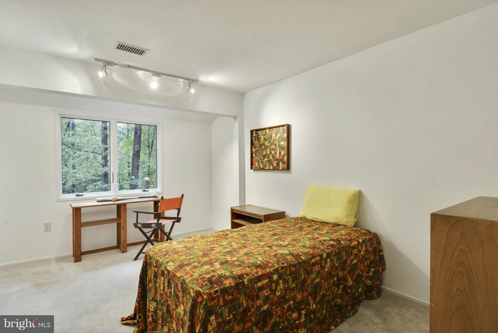 2600 Tack Lane Reston, VA 20191 - Photo 21 of 30 a bedroom with a bed and a table