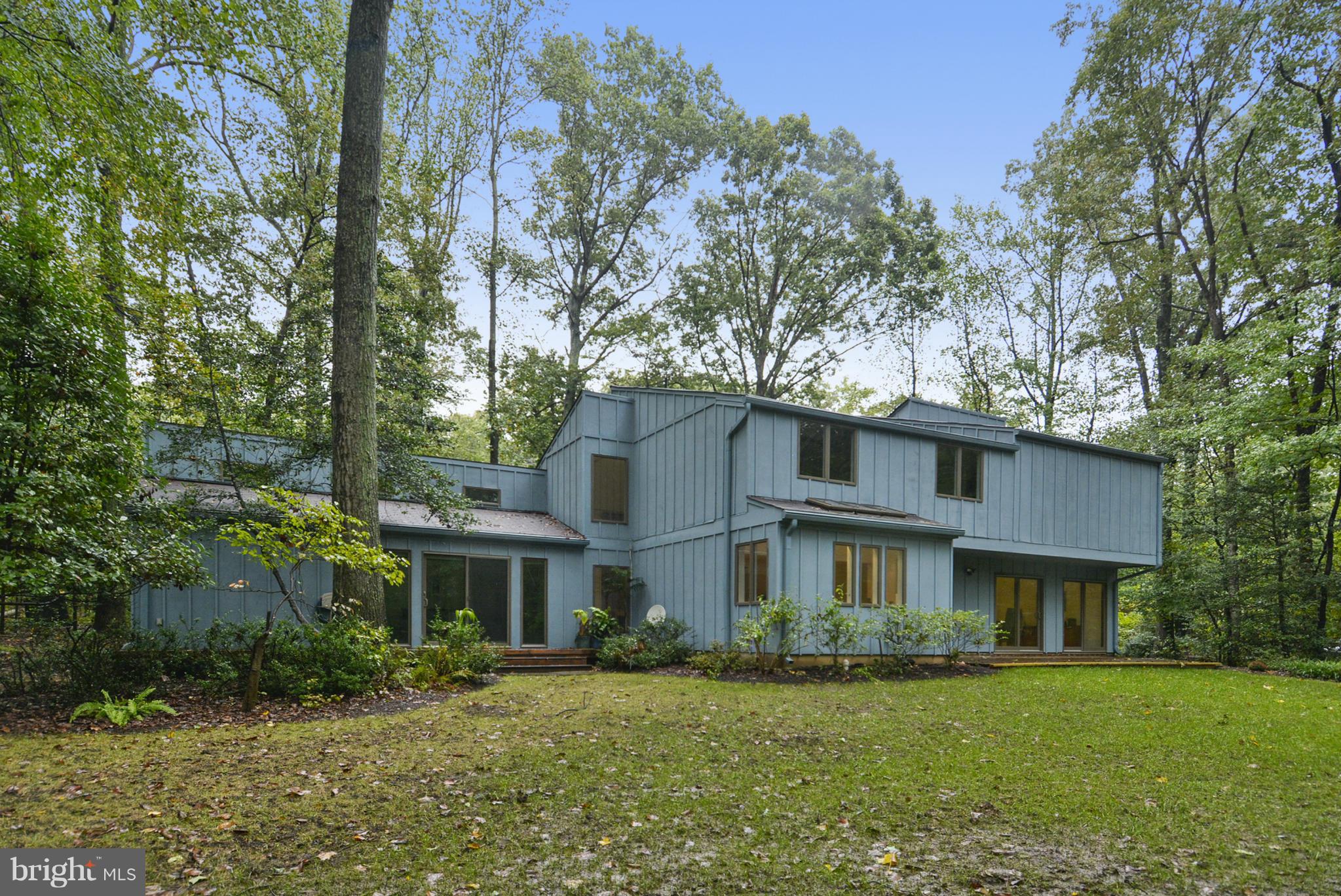 2600 Tack Lane Reston, VA 20191 - Photo 23 of 30 a view of a big yard in front of a brick house with large windows